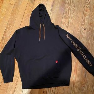 Black Troll Co hoodie with tan accents